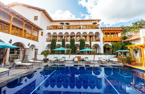 Outdoor pool, open 10:00 AM to 5:00 PM, pool umbrellas, pool loungers