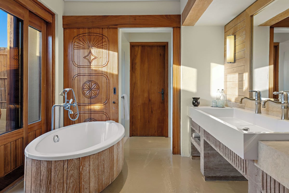 separate bathtub and shower, deep-soaking bathtub, rainfall showerhead