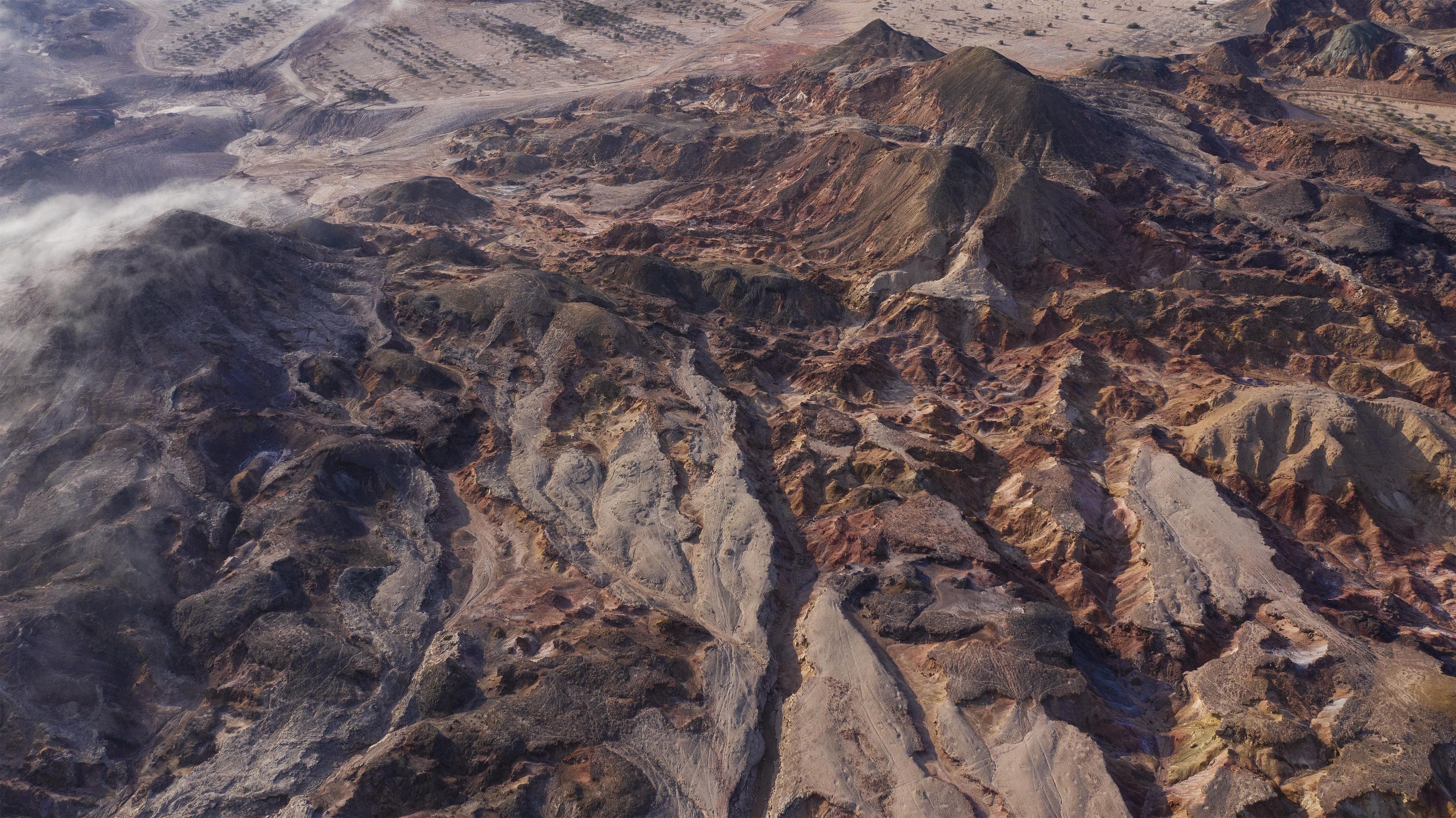 A rugged mountainous terrain with a narrow valley.