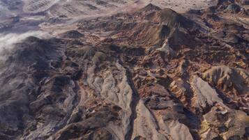 A rugged mountainous terrain with a narrow valley.