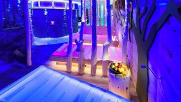 Relax in a unique, nature-inspired space with a central seating area and various seating options.