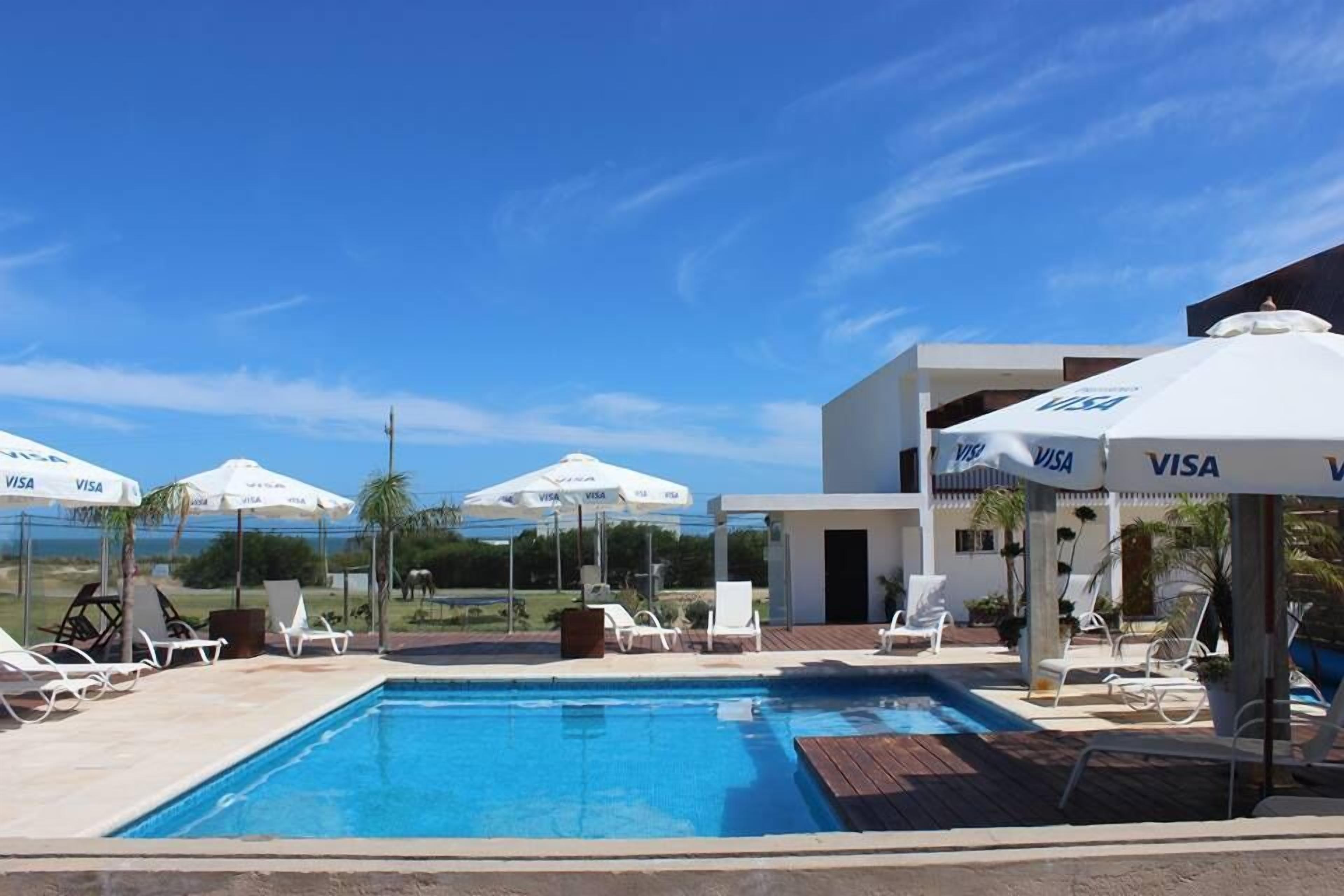 outdoor pool, pool umbrellas, pool loungers