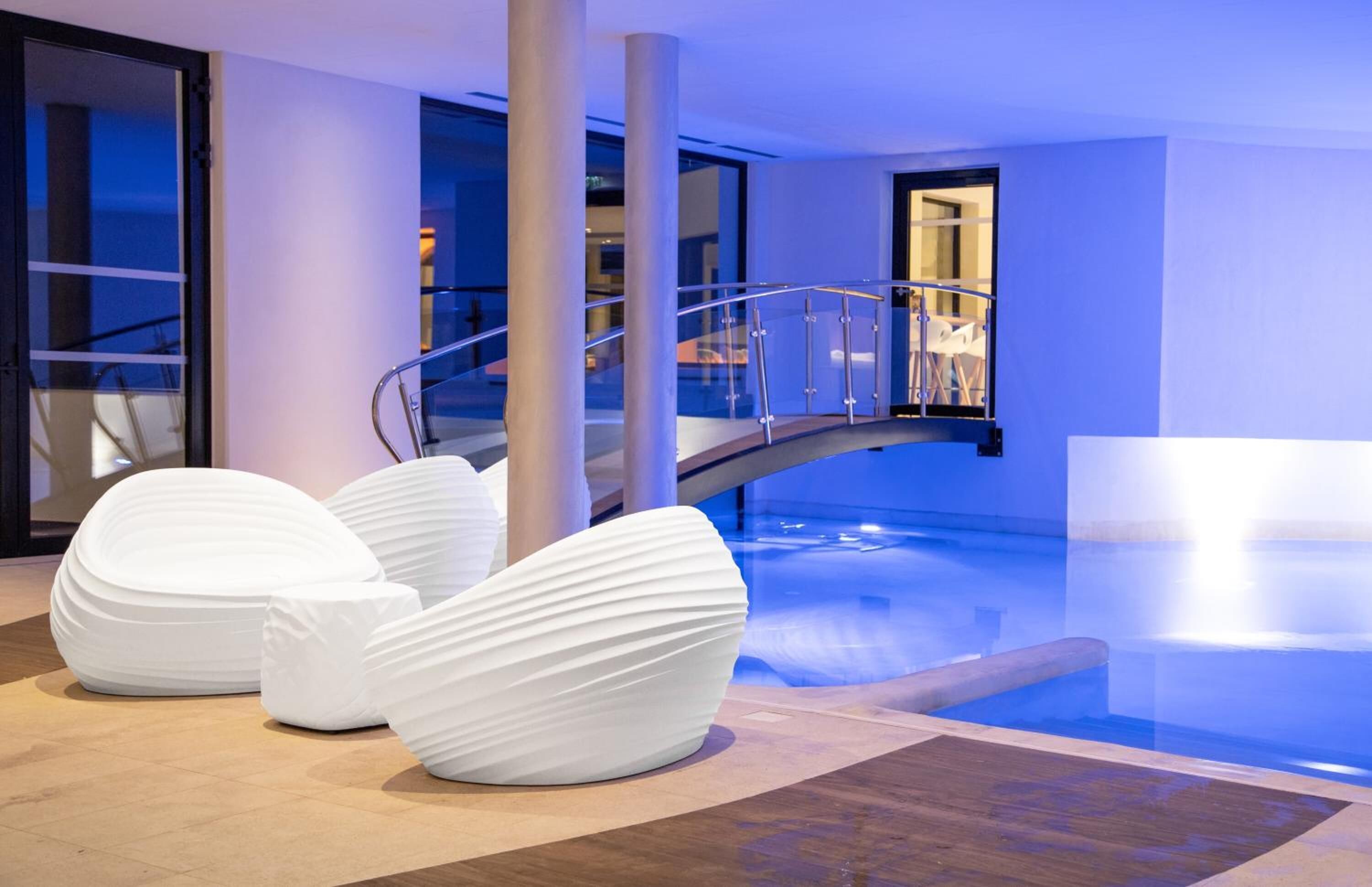 indoor pool, outdoor pool, pool umbrellas, pool loungers