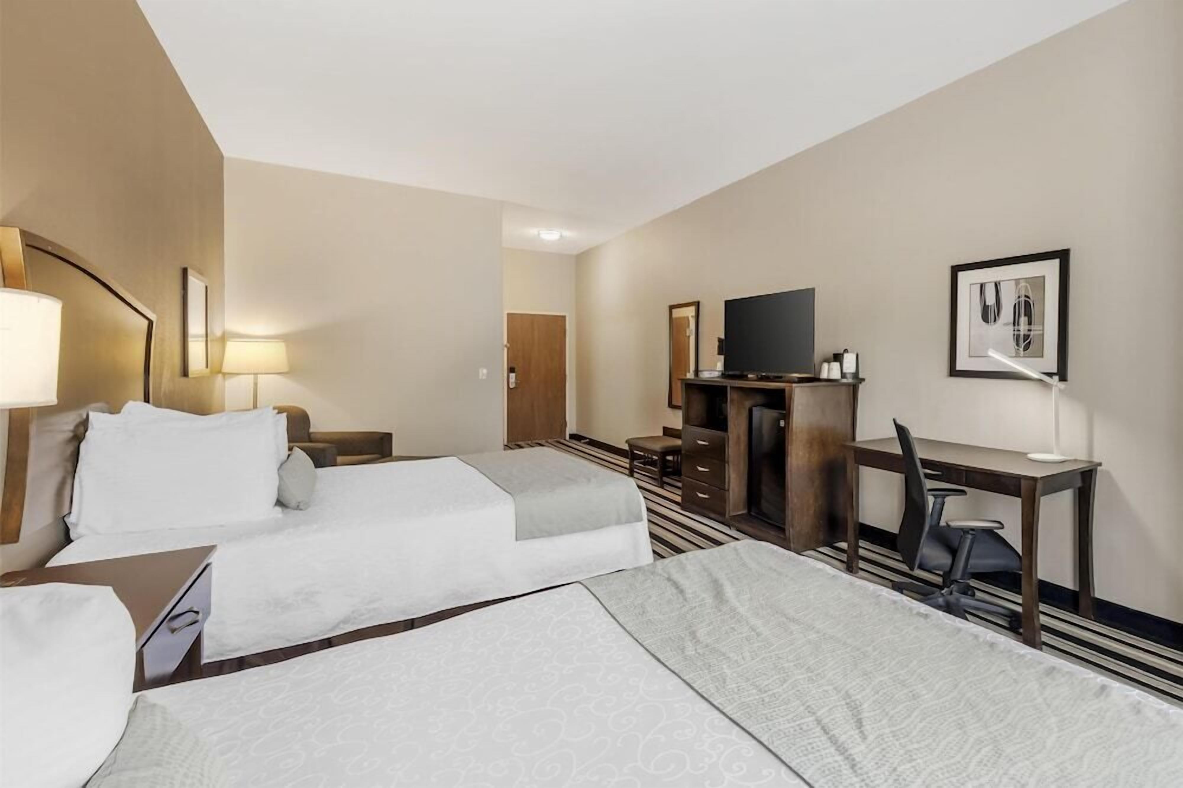 Premium bedding, pillowtop beds, desk, laptop workspace