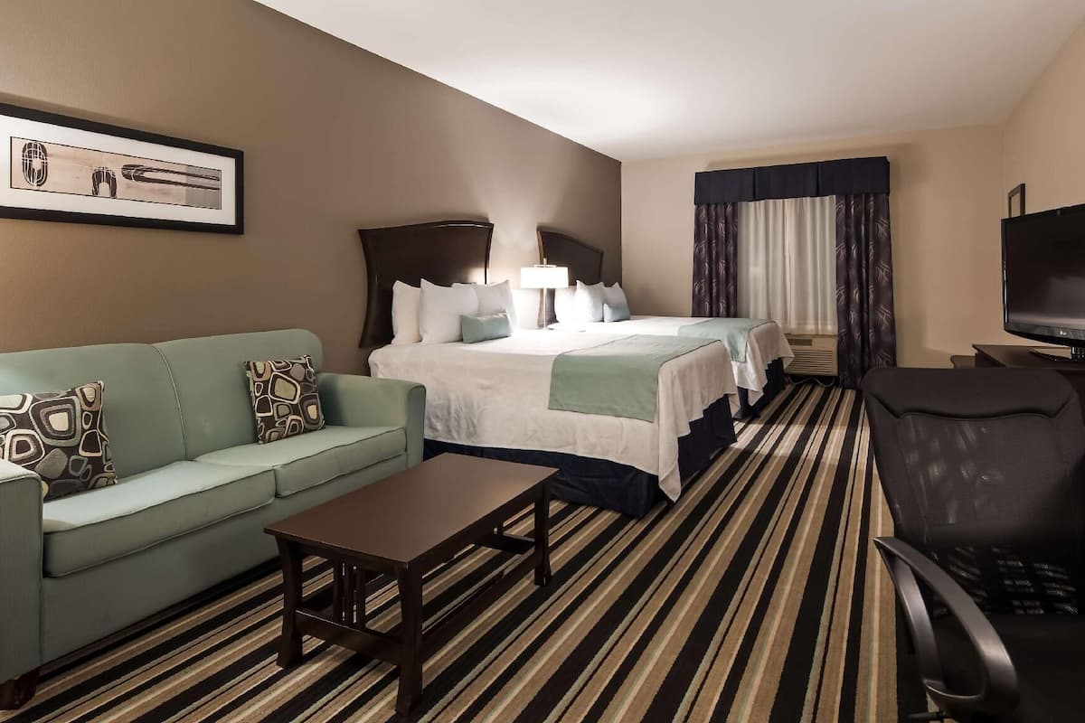 Premium bedding, pillow-top beds, desk, laptop workspace