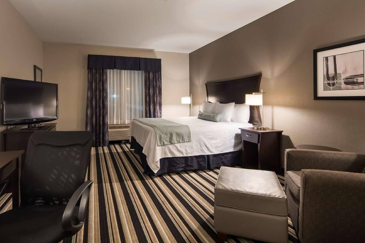 Premium bedding, pillow-top beds, desk, laptop workspace