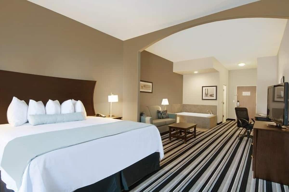 Premium bedding, pillow-top beds, desk, laptop workspace
