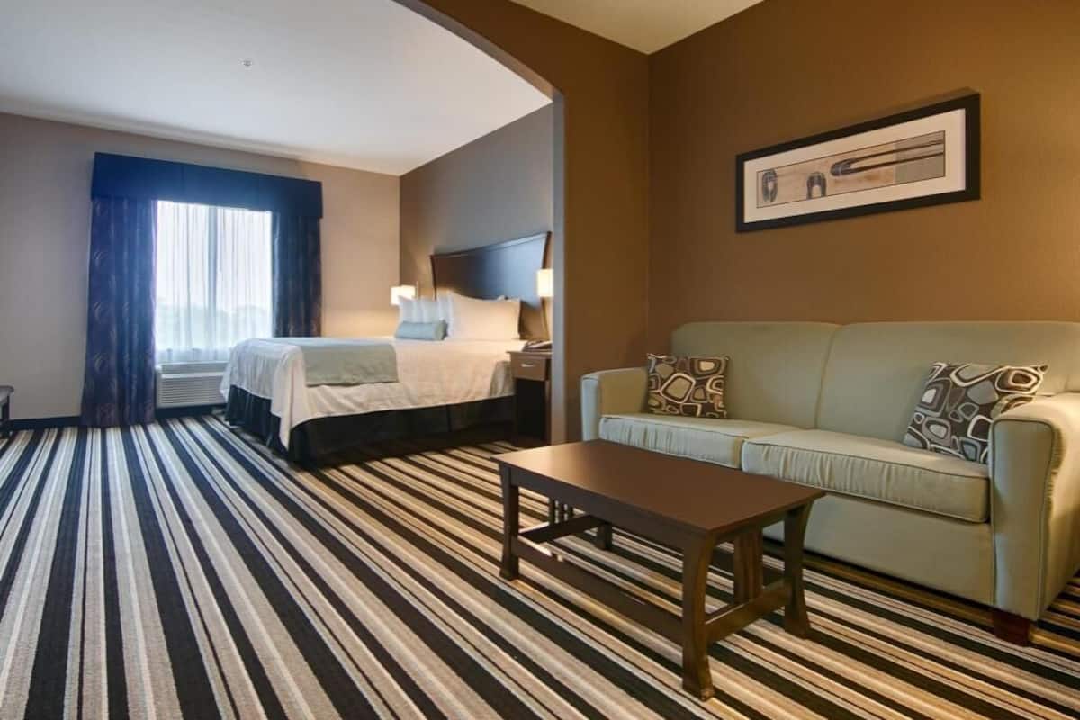 Premium bedding, pillow-top beds, desk, laptop workspace