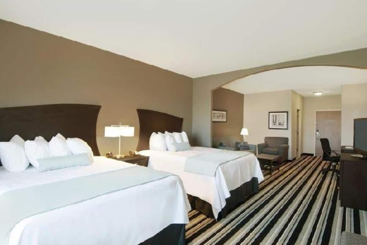 Premium bedding, pillow-top beds, desk, laptop workspace