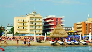 On the beach, white sand, free beach cabanas, sun-loungers