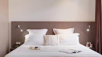 Luxe beddengoed, pillowtop-bedden, een kluis op de kamer, een bureau