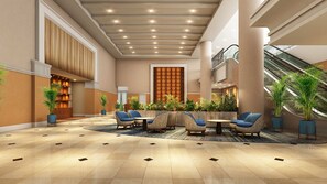 A spacious lobby with a high ceiling, a central seating area, and a staircase. - ANA Crowne Plaza Chiryu by IHG (Chiryu)