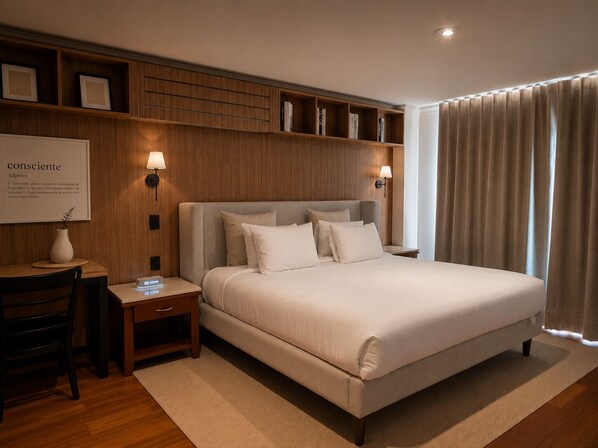 A hotel room with a large bed, bedside tables, a desk, and a bookshelf. - Residence L'heritage Hipólito Taine by Bluebay (Mexico City)