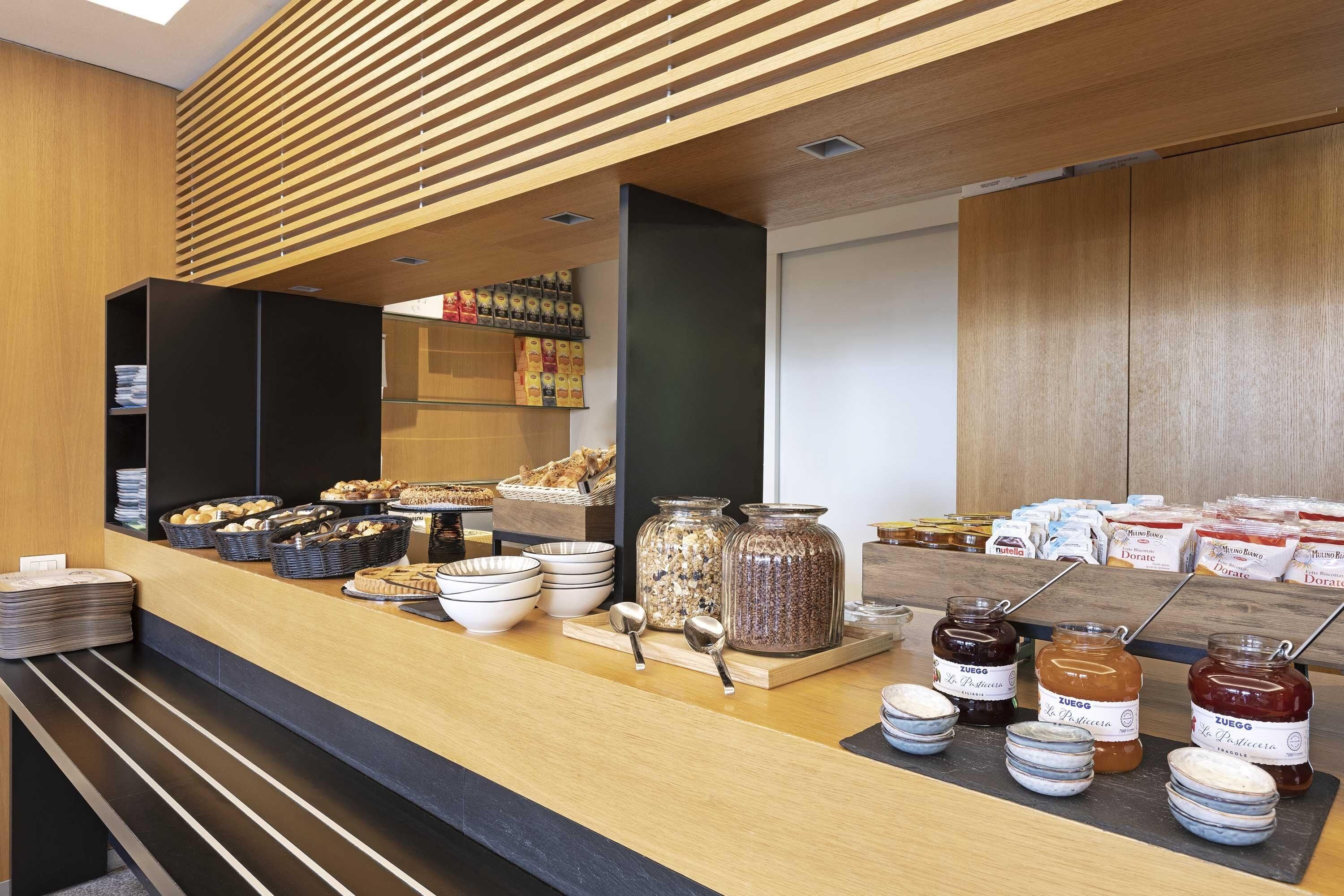 A breakfast buffet with various food items and condiments.