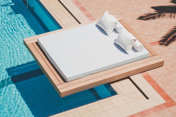 Seasonal outdoor pool, open 8:00 AM to 7:00 PM, free pool cabanas