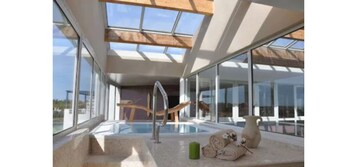 Indoor pool, open 9:00 AM to 9:00 PM, sun loungers