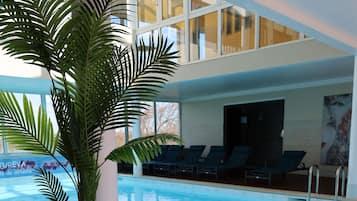 Indoor pool, open 9:00 AM to 9:00 PM, pool loungers