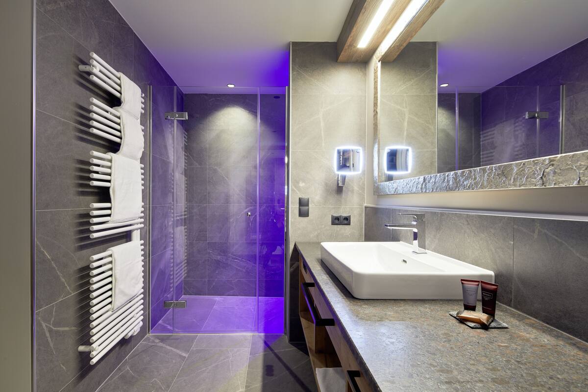 panoramic suite, 1 bedroom, mountain view (style_on point) | bathroom | hair dryer, bathrobes, slippers, towels