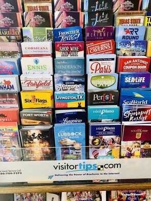 A collection of travel brochures for various Texas destinations.