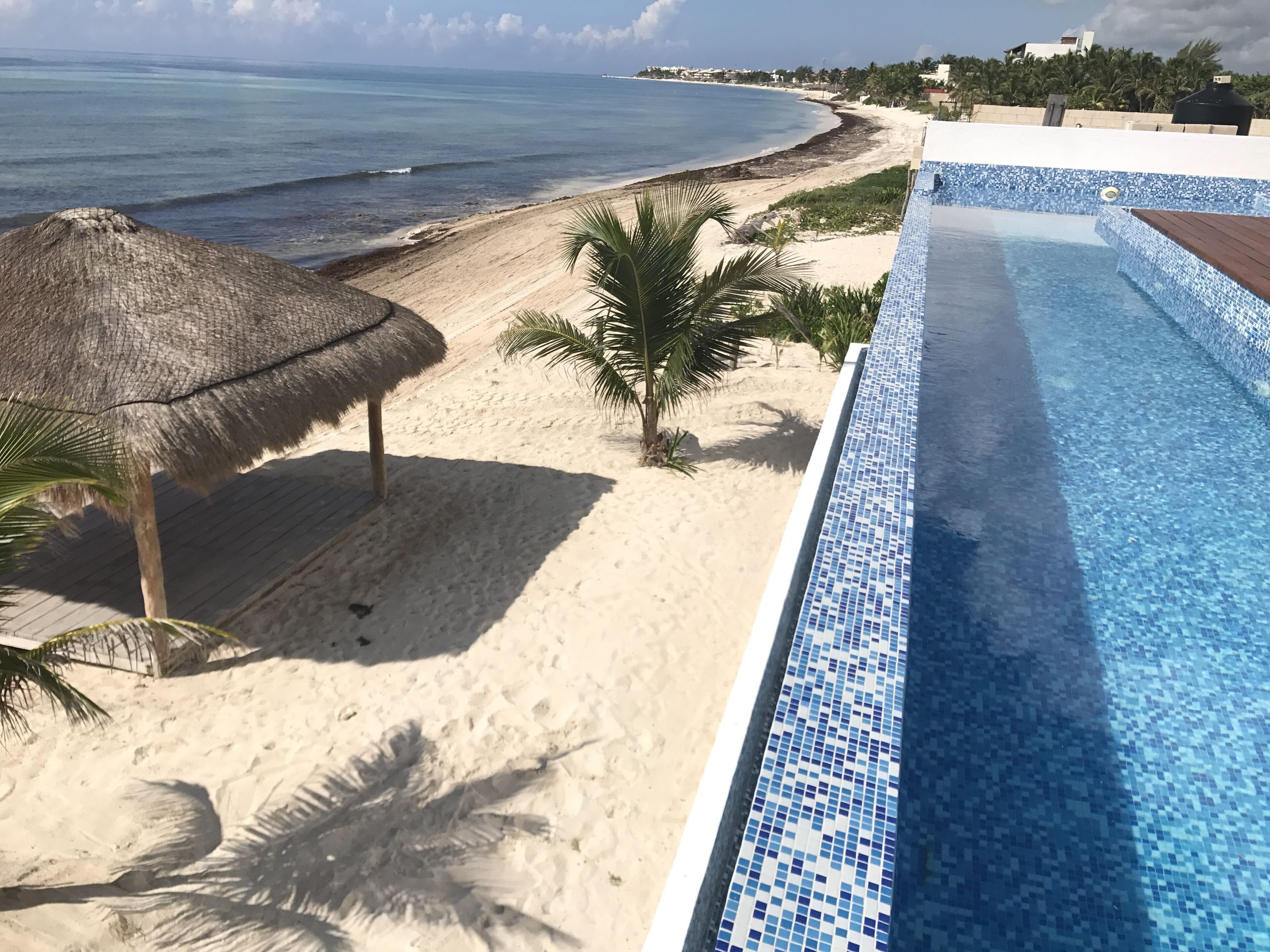 On the beach, white sand, free beach cabanas, beach towels