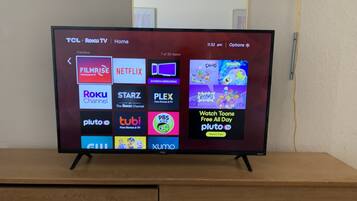 Desk, laptop workspace, blackout curtains, iron/ironing board