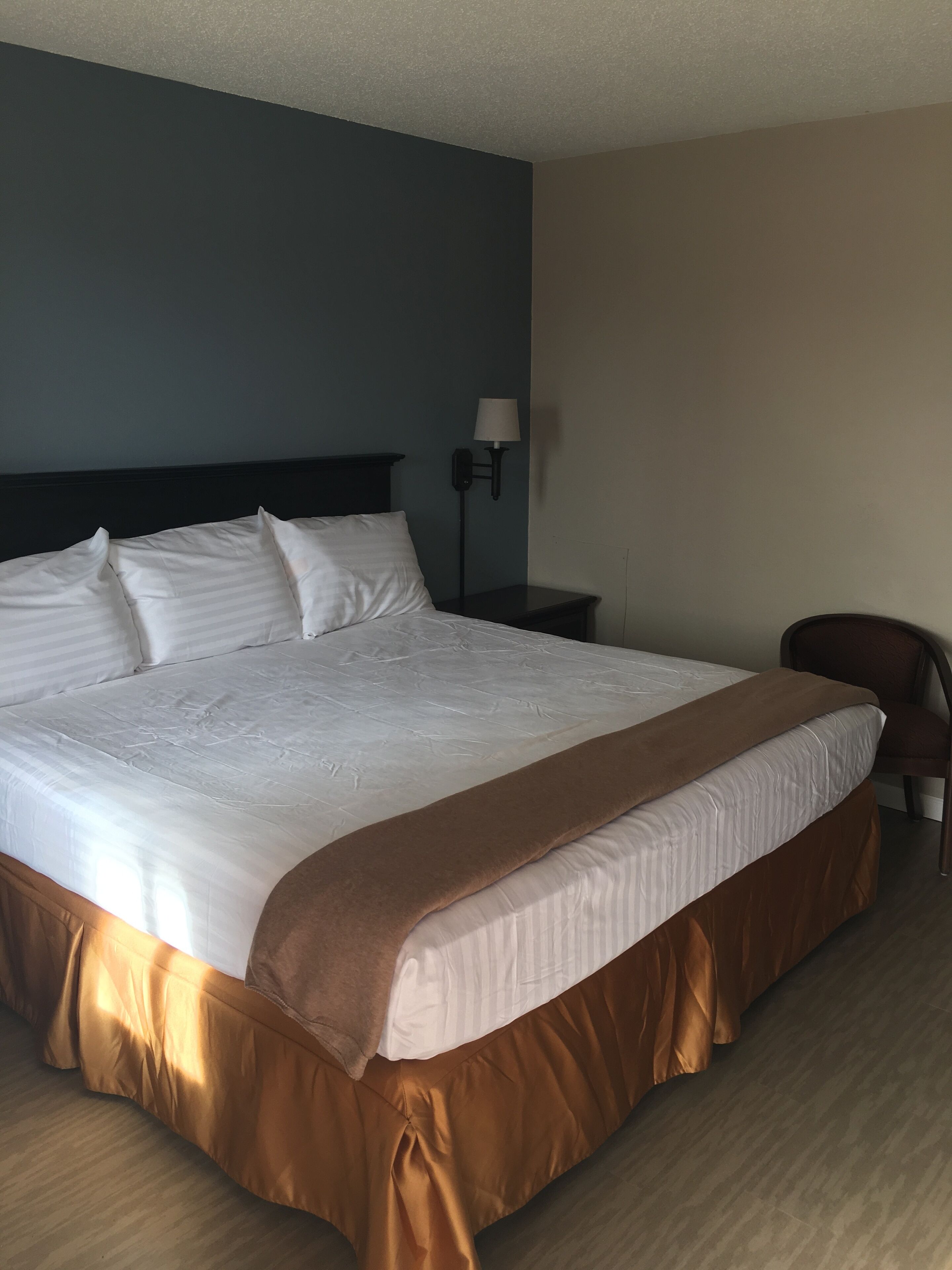 Desk, laptop workspace, blackout drapes, iron/ironing board