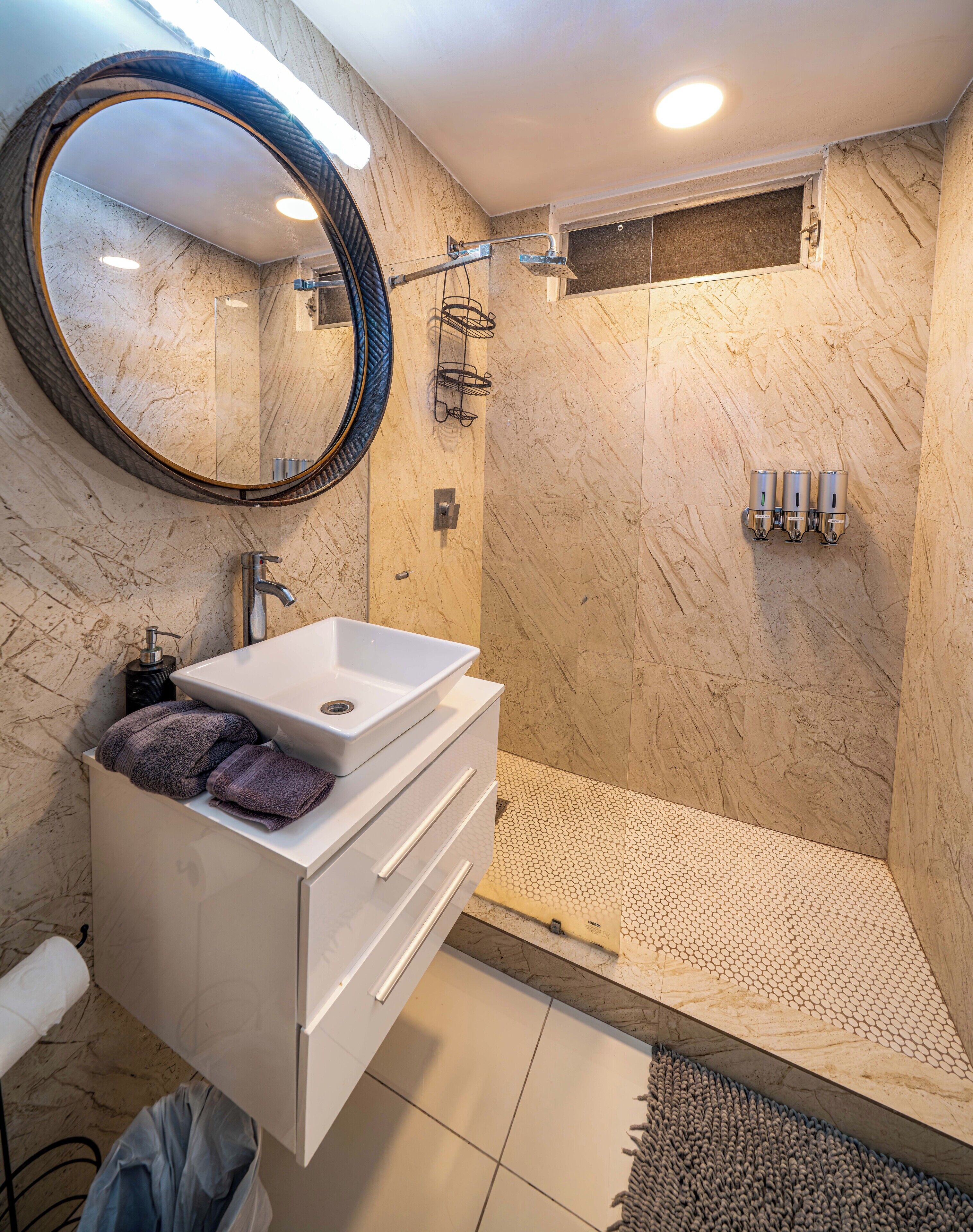 Shower, hair dryer, towels, toilet paper