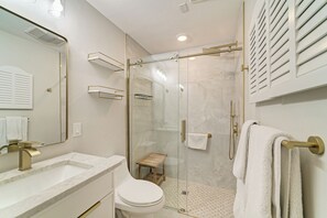 Shower, hair dryer, towels, toilet paper