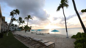 On the beach, sun loungers, beach towels