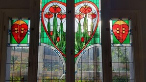 A set of stained glass windows with floral designs. - Peaceful Pernaja (Loviisa)