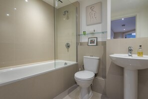Combined shower/tub, eco-friendly toiletries, hair dryer, towels