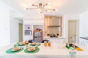Fridge, microwave, electric kettle, cookware/dishes/utensils