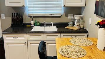 Fridge, microwave, stovetop, coffee/tea maker