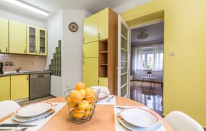 Enjoy cooking in this well-equipped kitchen with a large window offering a view.