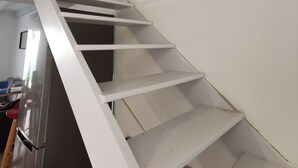 A white staircase with a handrail, leading to an upper floor. - Duplex T3 Anglet - Parking / Terrace / Pool - (Anglet)