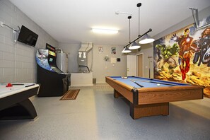 Enjoy a game of pool or watch your favorite shows on the flat-screen TV in this recreational room.