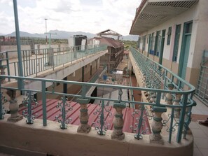 A multi-level building with balconies and railings.