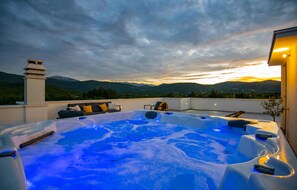 A hot tub with a mountain view, a sofa, and a chair on a rooftop. - Lovely home in Poljica with sauna (Poljica)