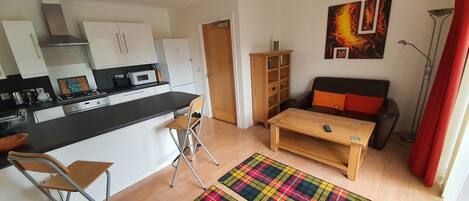 Apartment | Living room | 30-inch TV with cable channels