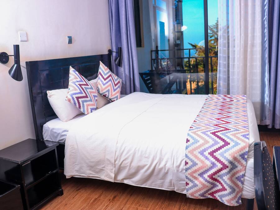 Premium bedding, pillow-top beds, desk, laptop workspace