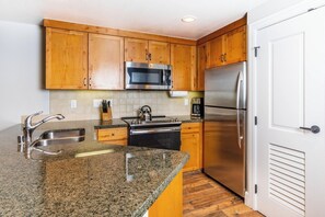 Microwave, dishwasher, coffee/tea maker, cookware/dishes/utensils