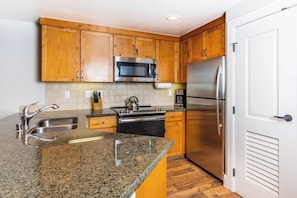 Microwave, dishwasher, coffee/tea maker, cookware/dishes/utensils