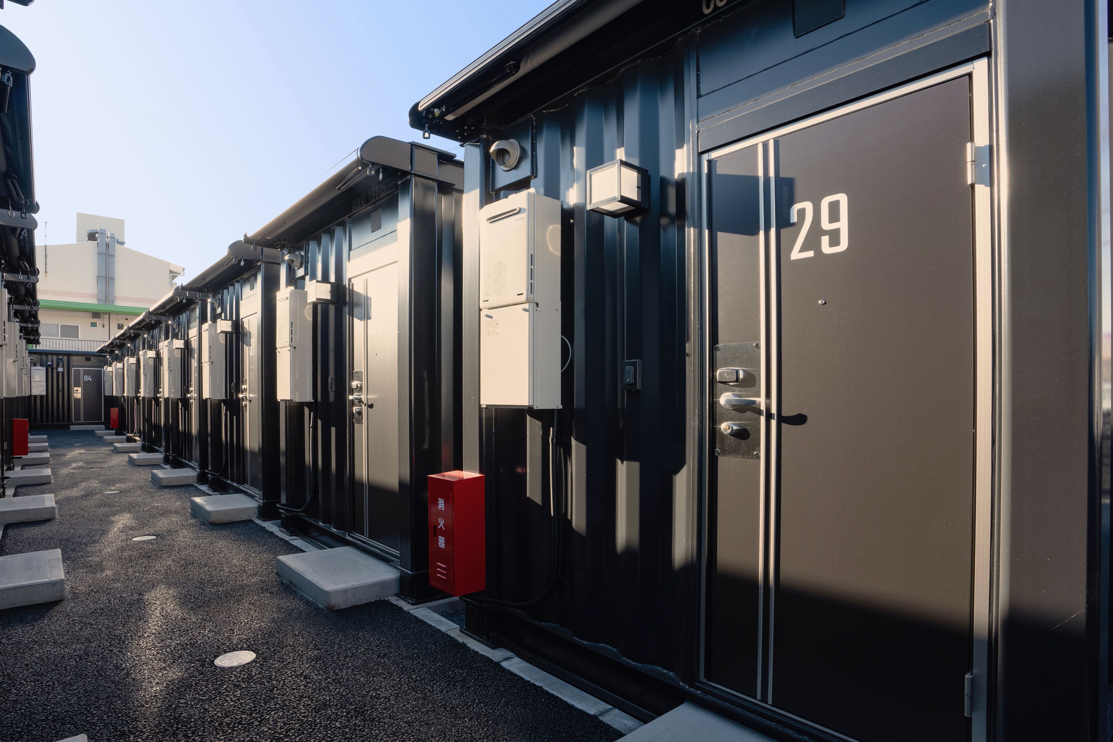 A row of identical metal lockers with numbers on them, likely for storage or security purposes.