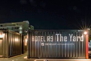 A hotel entrance with a large sign reading "HOTEL R9 The Yard" and the logo "DEVELOP HOTELS & RESORTS". - Hotel R9 The Yard Togane (Togane)