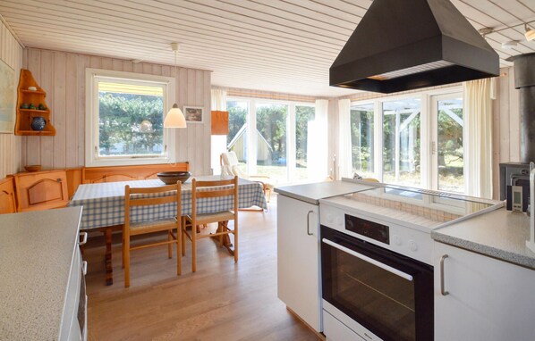 Fridge, stovetop, dishwasher, coffee/tea maker