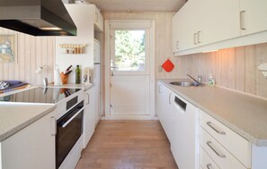 Fridge, stovetop, dishwasher, coffee/tea maker