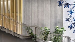 A modern interior with a staircase, vertical blinds, and potted plants. - Executively Inspired - 2 Bed 2 Bath Apt on Queen St with Carpark Fast WiFi Rooftop Pool and Sleeps 5 (Brisbane City)