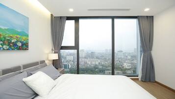 Apartamento Deluxe | Caja fuerte, escritorio, cortinas opacas y tabla de planchar con plancha