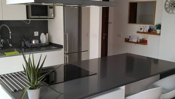 Fridge, microwave, cookware/dishes/utensils