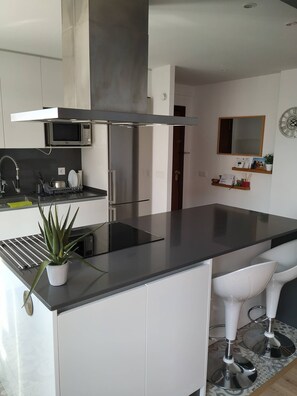 Fridge, microwave, cookware/dishes/utensils